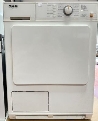 a white washer and dryer sitting next to each other on a table