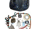 a picture of a purse and some jewelry on a white background