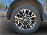a close up view of a wheel on a blue truck