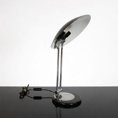 an image of a desk lamp on a black table