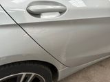 a close up of a car door handle on the side of the car