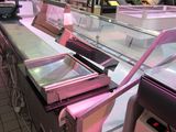 a refrigerated display case in a grocery store
