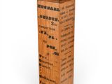 clock tower made of wood with chinese writing on the sides