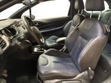 the interior of a car with blue leather seats and a steering wheel