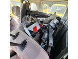 a car with a bunch of junk in the back of it