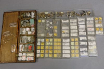 a wooden box filled with assorted items on top of a table