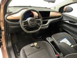 the interior of a small car with a steering wheel and dashboard