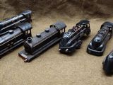 five toy trains sitting next to each other on a table