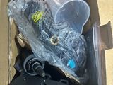 a cardboard box with a bunch of items inside of it