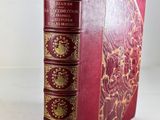 a close up of a book on a table with a white background