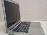 a laptop computer sitting on a table with a white background