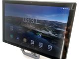 someone is holding a tablet with a screen on top of it