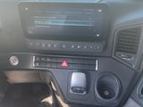 a dashboard of a car with a radio and a steering wheel