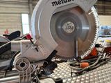 someone is using a circular saw to cut a piece of metal