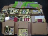 a lot of electronic devices in a box on the floor
