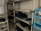 a room with a lot of shelves with shoes on them