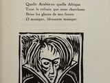an open book with a black and white drawing of a woman ' s face