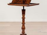 an old wooden table with a laptop on top of it