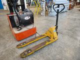 a forklift sitting on the floor in a warehouse
