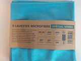 blue cloth with a tag on it sitting on a white surface