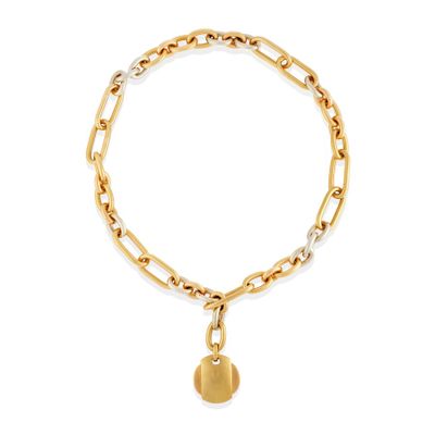 a gold chain bracelet with a heart charm on a white background