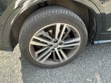 a close up of a tire on a black car