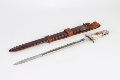 knife and sheath on a white surface