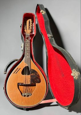 a guitar that is sitting in a case on a table