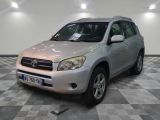 a picture of a silver toyota rav parked in a garage