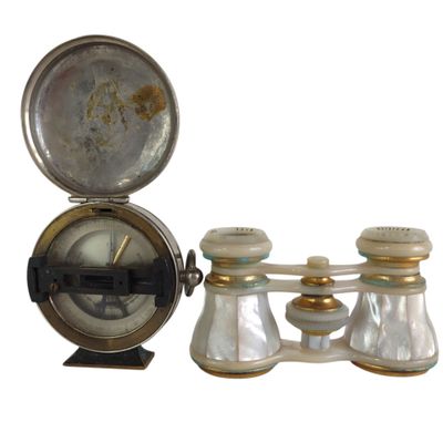 a clock and a pair of salt and pepper shakers on a stand