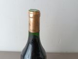 a bottle of wine that is sitting on a table