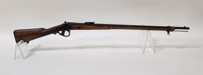 a rifle with a wooden barrel and clear acrylic display stand