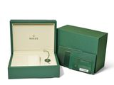 an image of a green box with a pair of earrings in it