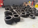 a lot of tires that are sitting on the floor