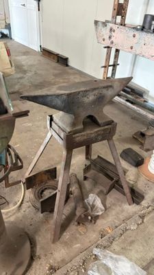 an old machine that is being worked on in a workshop