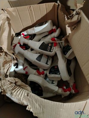 a cardboard box filled with many different types of shoes