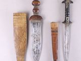 several different types of knives are displayed on a white surface