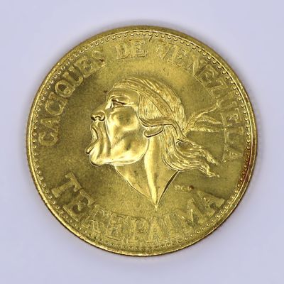 gold coin with a portrait of a woman on it