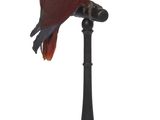 un oiseau rouge et bleu perché sur un socle noir