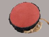 an image of a red and black object with a rope around it