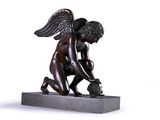 statue of a boy kneeling on a block with a bird in his hand