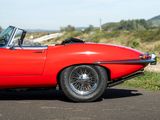 a red car that is parked on the side of the road