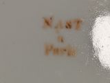 a close up view of a white plate with writing on it