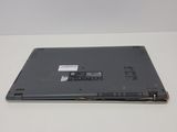 the laptop is sitting on a white surface with a sticker on it