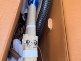 a cardboard box with a bike in it and a pair of scissors in it
