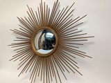 a mirror that is hanging on the wall in the room