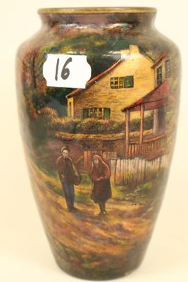 a vase with a painting of a couple walking down the street