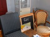 two chairs and a table in the corner of a room