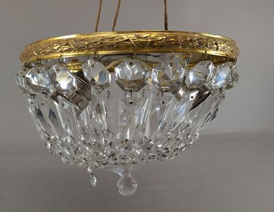 an image of a crystal chandelier hanging from a ceiling