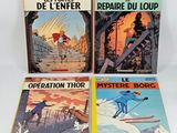 three books on a white surface with a picture of a man on skis and a man on a snowboard
